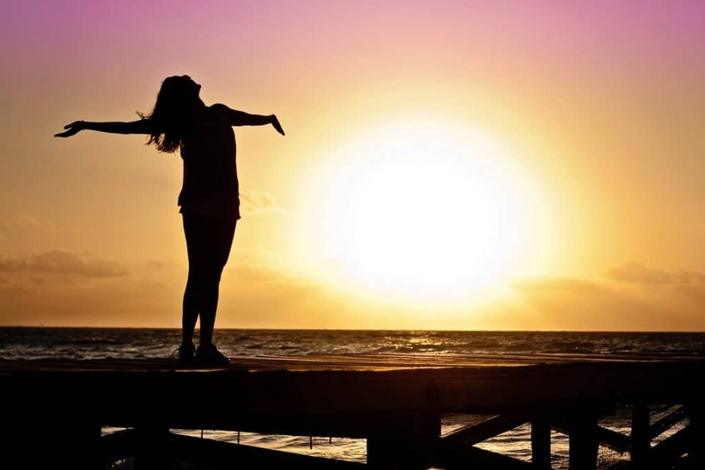 happy woman on boardwalk